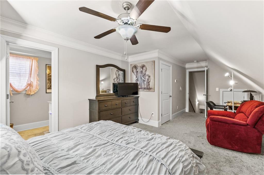 585 Hanover Drive Villa Rica, GA 30180 - Photo 39 of 72 a bedroom with a bed dresser and a window