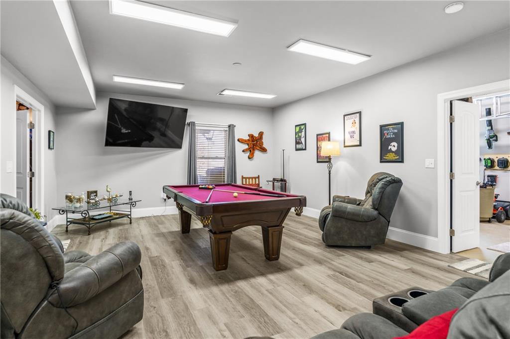 585 Hanover Drive Villa Rica, GA 30180 - Photo 42 of 72 a living room with furniture and a flat screen tv