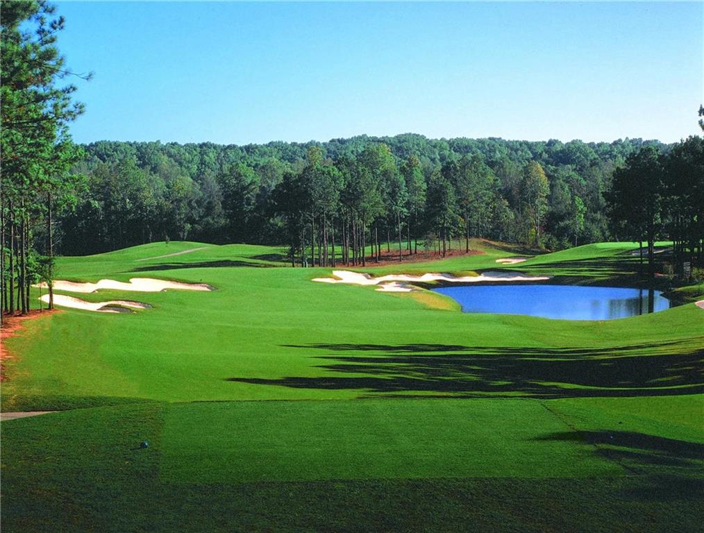 585 Hanover Drive Villa Rica, GA 30180 - Photo 7 of 72 a view of a golf course with a lake