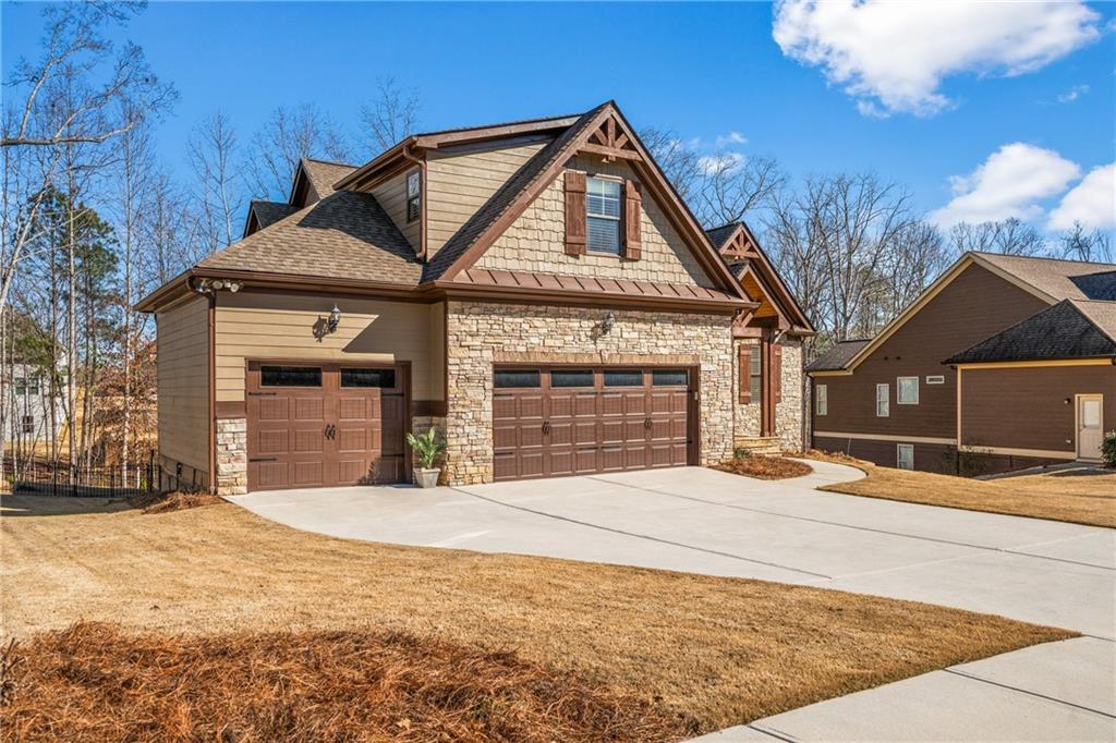585 Hanover Drive Villa Rica, GA 30180 - Photo 9 of 72 a front view of a house with a yard and garage