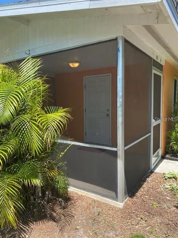 a kitchen with granite countertop a stove sink and cabinets
