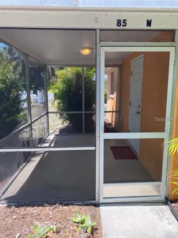 an empty room with wooden floor