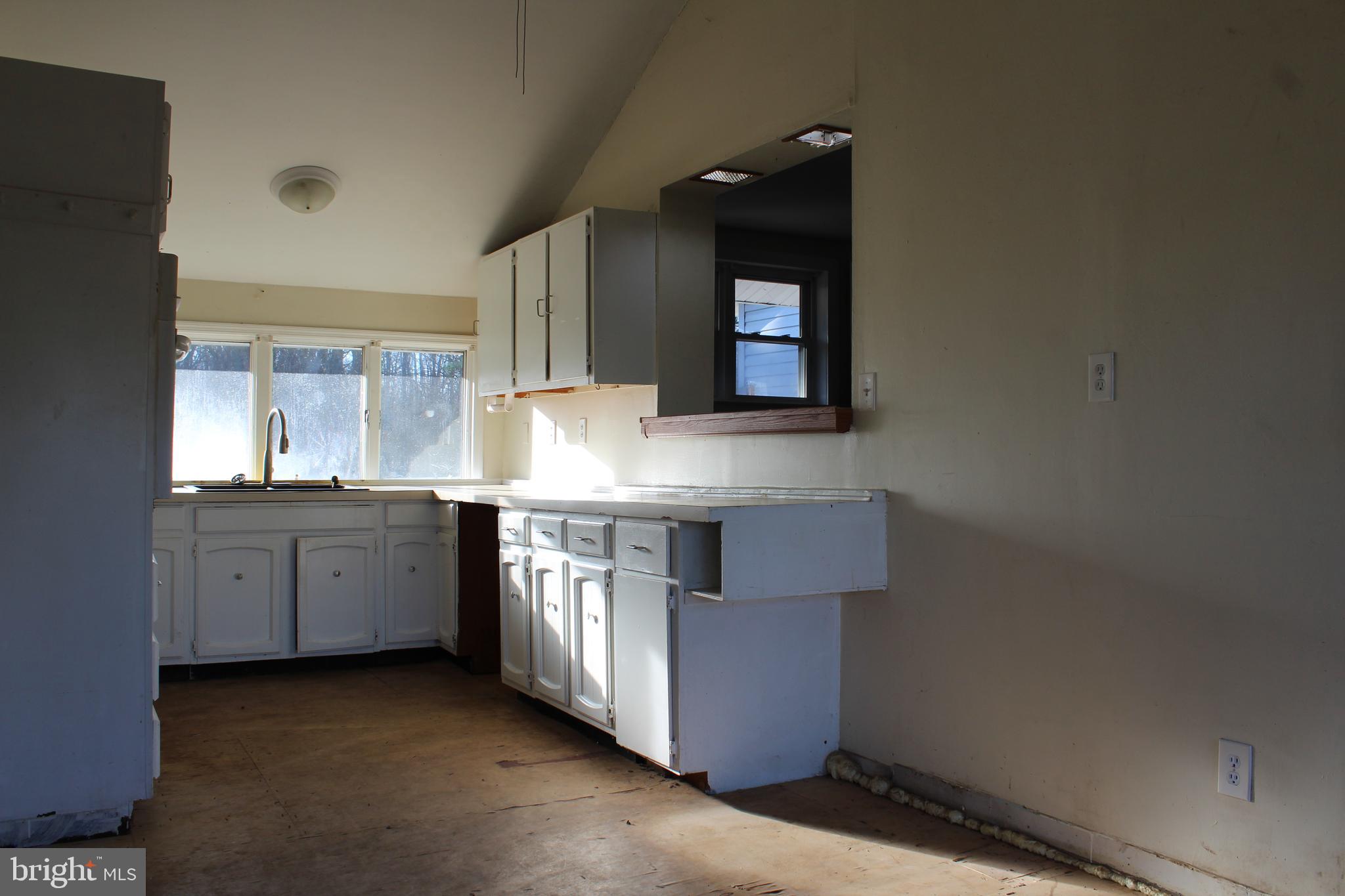 161 Sinnickson Landing Road Salem, NJ 08079 - Photo 8 of 35 a kitchen with granite countertop a sink and cabinets