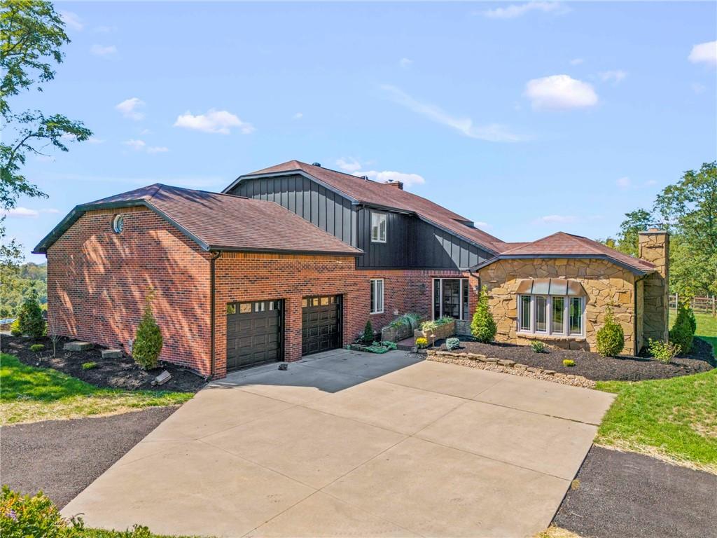603 Highland Ridge Road Claysville, PA 15323 - Photo 1 of 47 a front view of a house with a garden