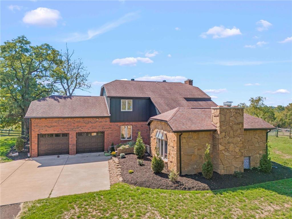 603 Highland Ridge Road Claysville, PA 15323 - Photo 2 of 47 a front view of a house with a yard