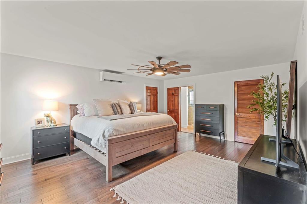 603 Highland Ridge Road Claysville, PA 15323 - Photo 24 of 47 a bedroom with a large bed and a flat tv screen on dresser