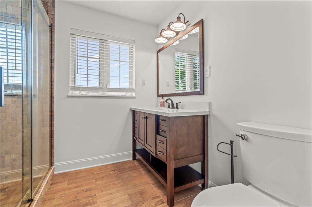 603 Highland Ridge Road Claysville, PA 15323 - Photo 26 of 47 a bathroom with a sink mirror vanity and toilet