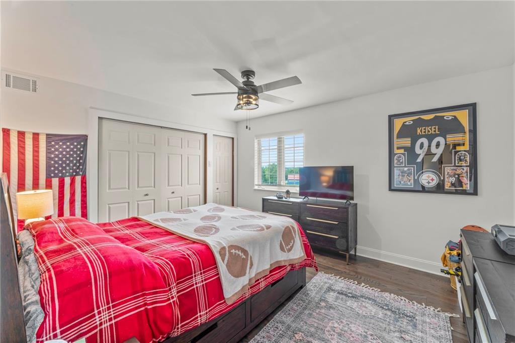 603 Highland Ridge Road Claysville, PA 15323 - Photo 28 of 47 a bedroom with a bed and a chandelier