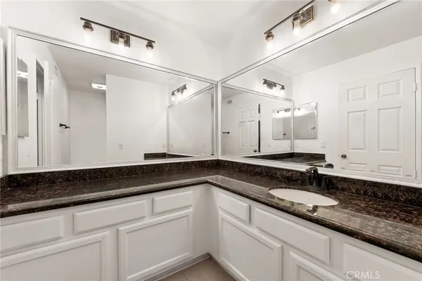a bathroom with a toilet and a bathtub