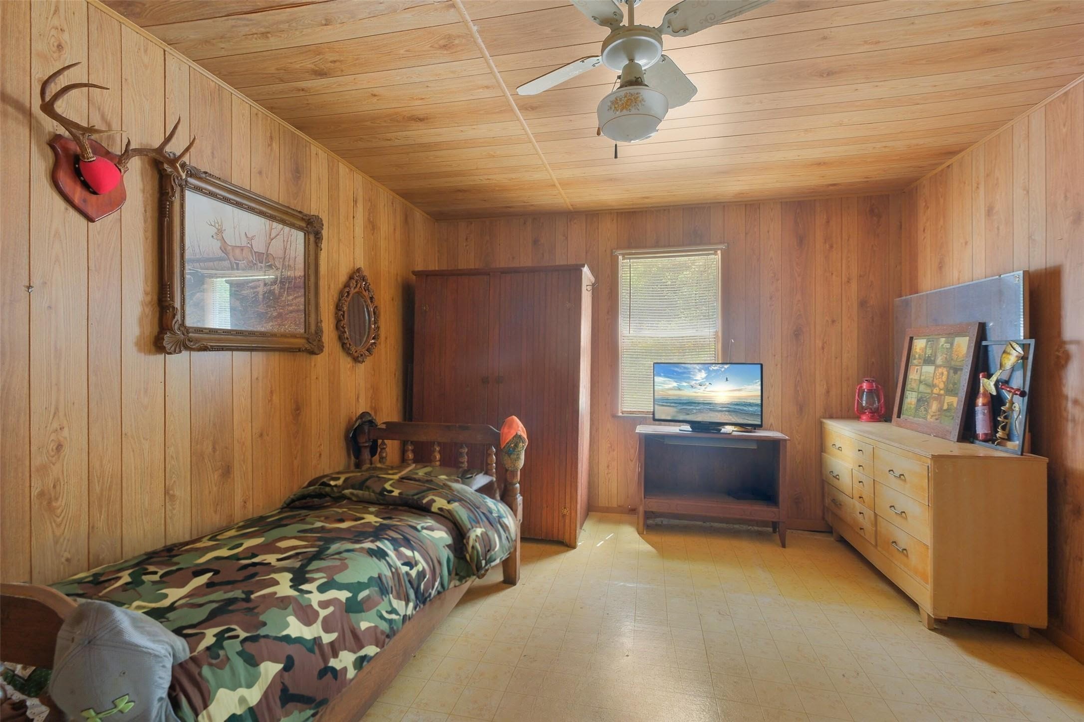 24718 Squirrel Road New Ulm, TX 78950 - Photo 21 of 26 a bedroom with bed and window