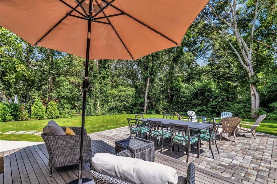 288 Lincoln Road Hyannis, MA 02601 - Photo 33 of 36 a view of a chair and tables in the back yard