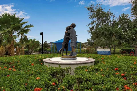 an aerial view of house with yard and lake view