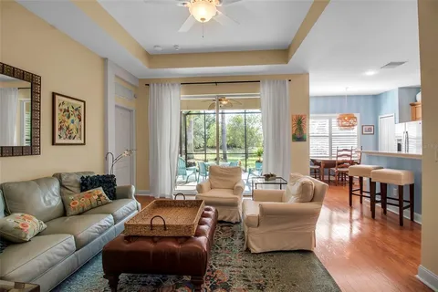 a living room with furniture a rug and a flat screen tv