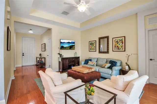 a living room with furniture a rug and a fireplace