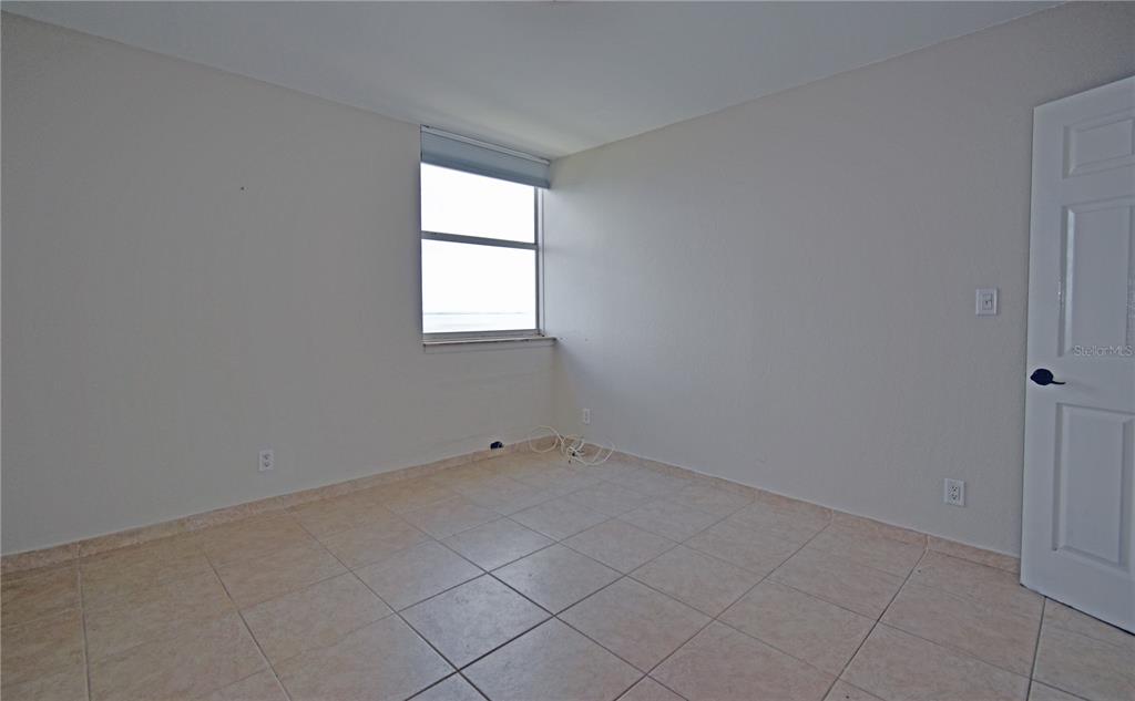 4015 Bayshore Boulevard, Unit 17F Tampa, FL 33611 - Photo 24 of 32 an empty room with a window