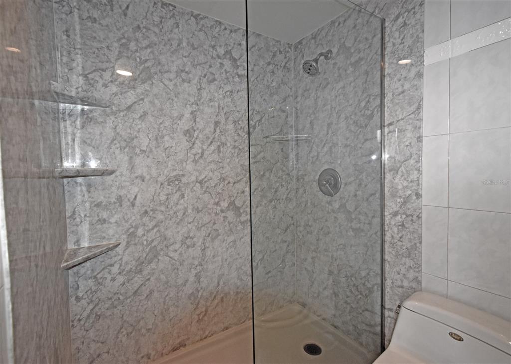 4015 Bayshore Boulevard, Unit 17F Tampa, FL 33611 - Photo 27 of 32 a bathroom with a shower