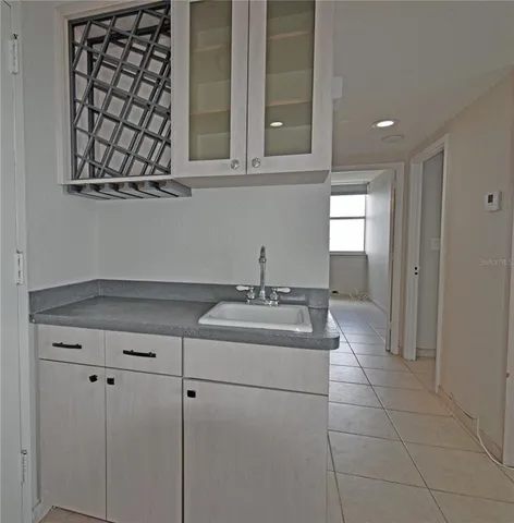 a kitchen with a sink and cabinets