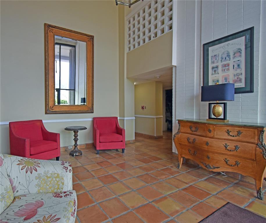 4015 Bayshore Boulevard, Unit 17F Tampa, FL 33611 - Photo 10 of 32 a living room with furniture and a two mirror