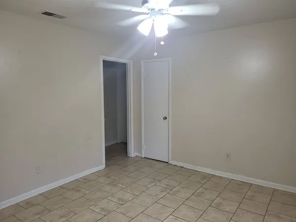 an empty room with a bathroom