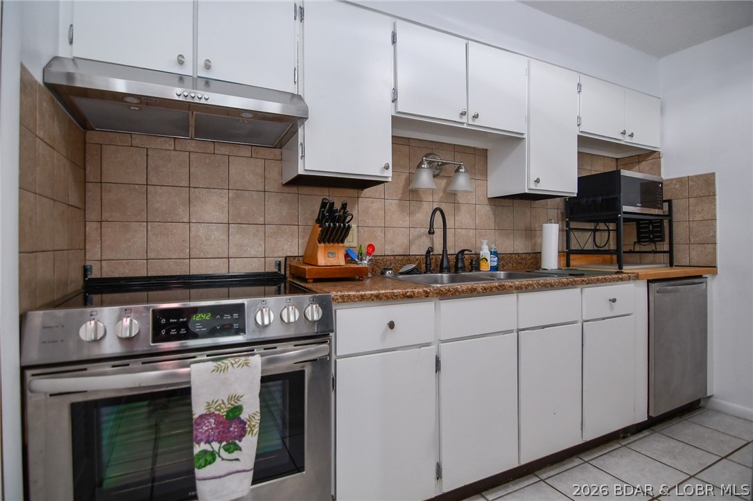 1118 Passover Road, Unit E216 Osage Beach, MO 65065 - Photo 7 of 31 Kitchen with stainless steel appliances