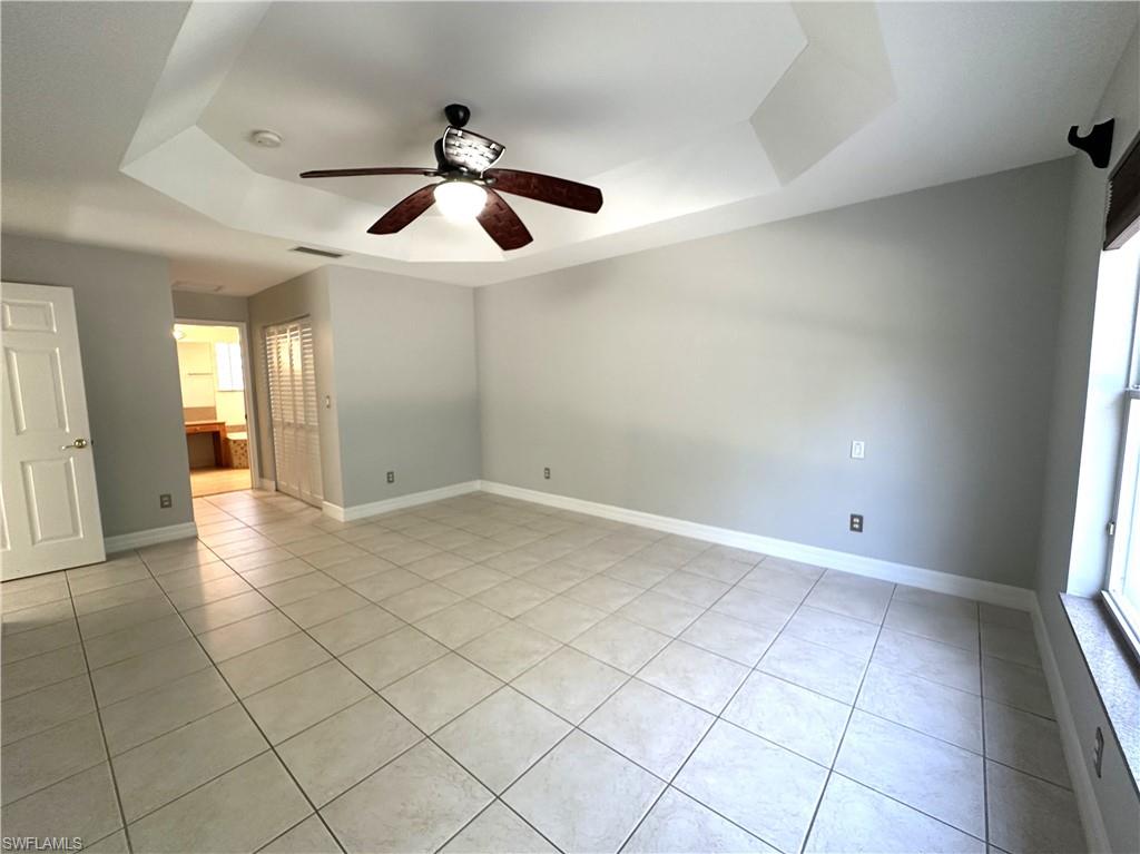 1356 Triandra Lane Naples, FL 34119 - Photo 13 of 38 a view of an empty room and window