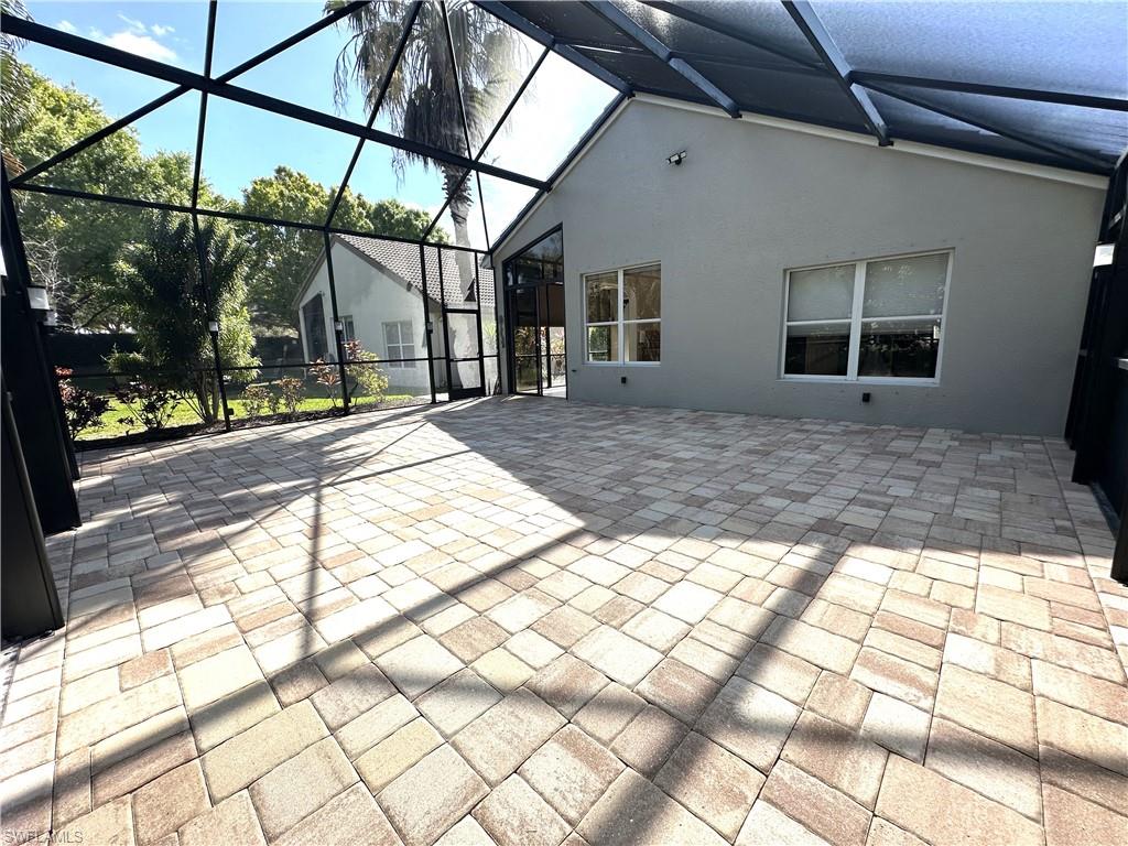 1356 Triandra Lane Naples, FL 34119 - Photo 28 of 38 a view of a house with a street