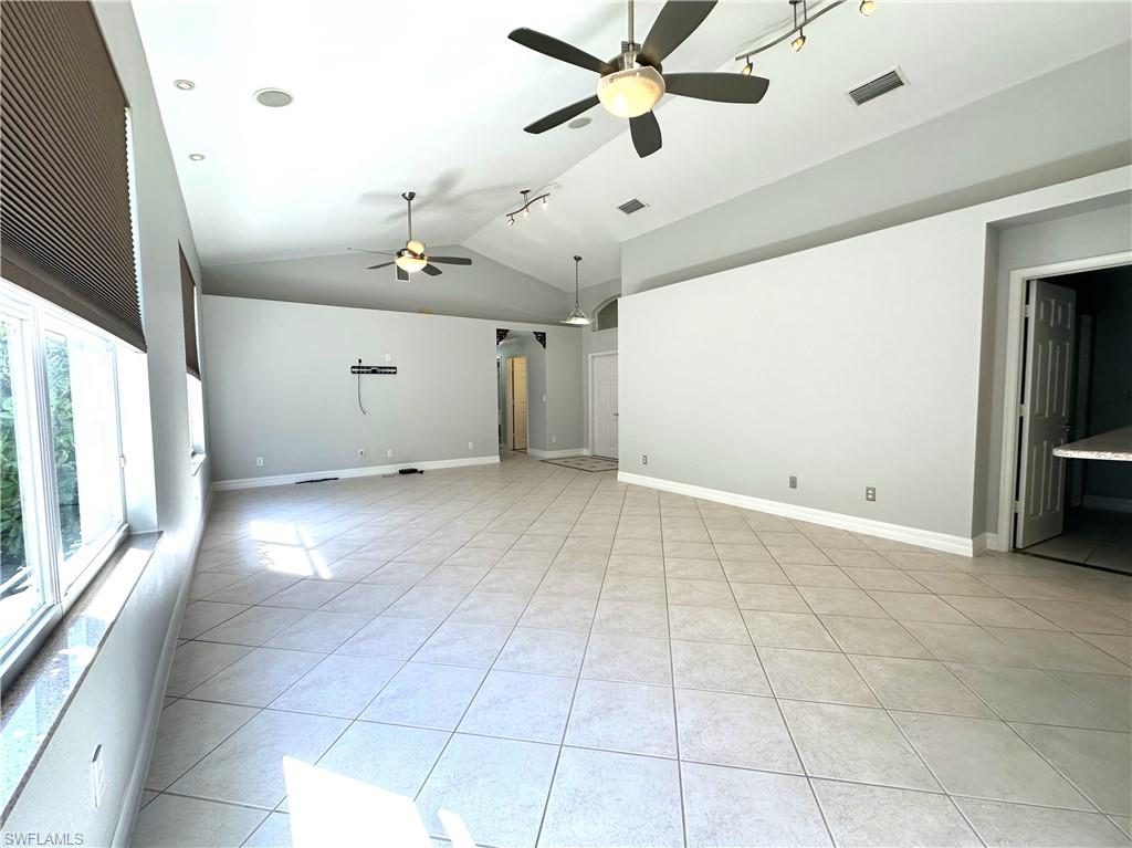 1356 Triandra Lane Naples, FL 34119 - Photo 5 of 38 a view of an empty room with a window