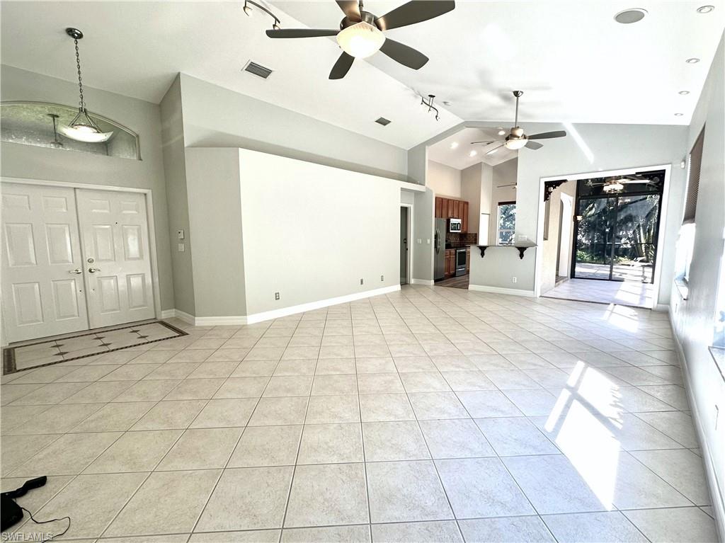1356 Triandra Lane Naples, FL 34119 - Photo 6 of 38 a view of a livingroom with a fireplace
