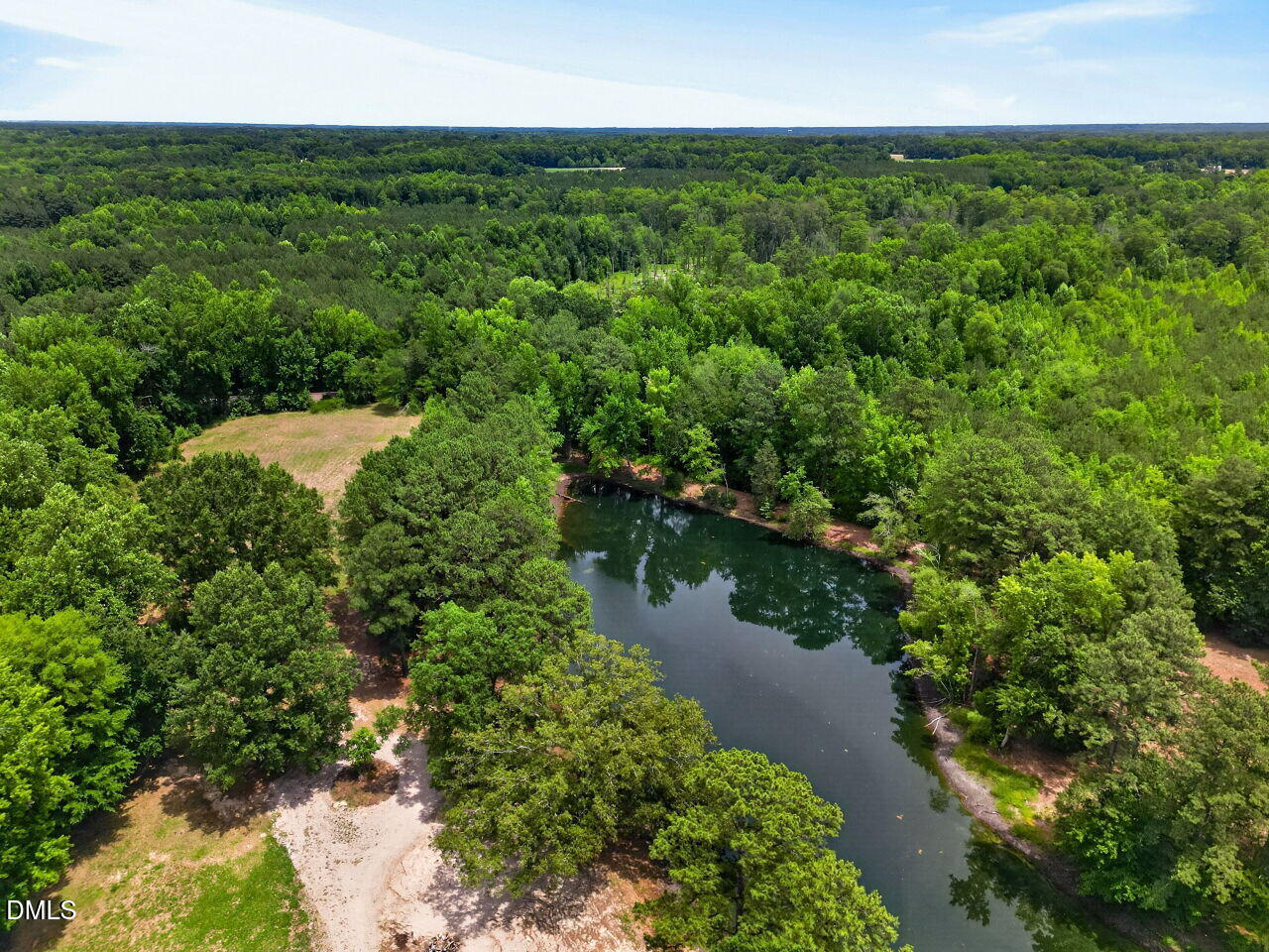 1217 Eagle Rock Road Wendell, NC 27591 - Photo 16 of 17 a view of a lake with a building in the background