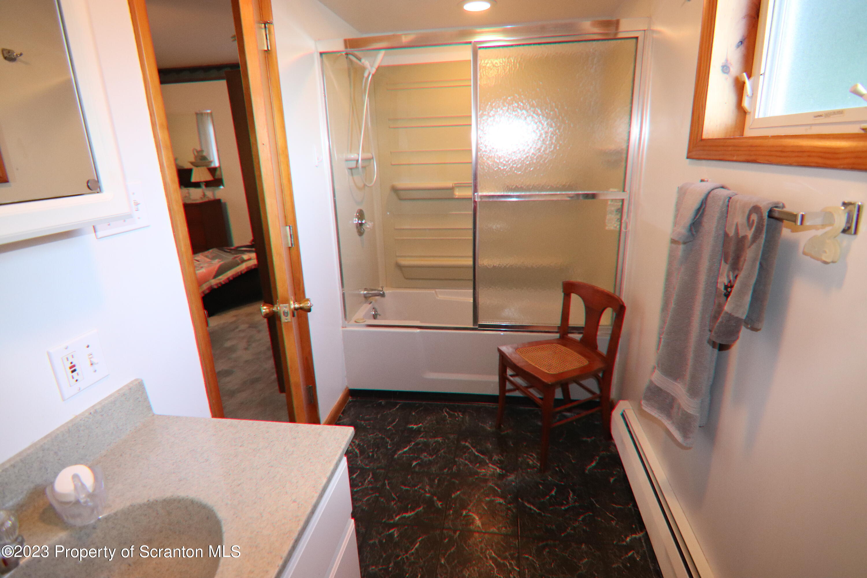183 Oliver Road Sweet Valley, PA 18656 - Photo 30 of 54 a bathroom with a tub and a shower