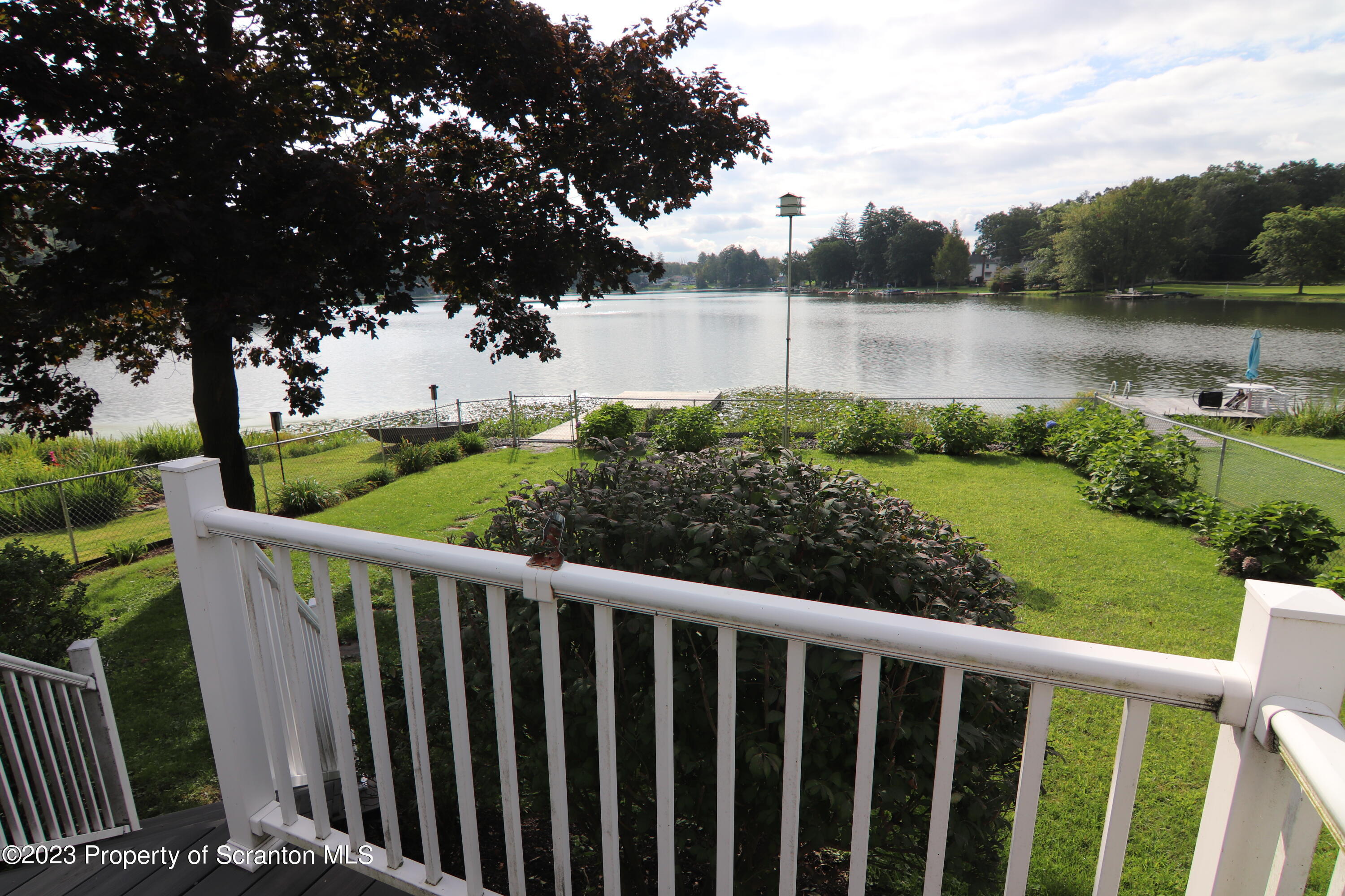 183 Oliver Road Sweet Valley, PA 18656 - Photo 4 of 54 a view of a green field with wooden fence