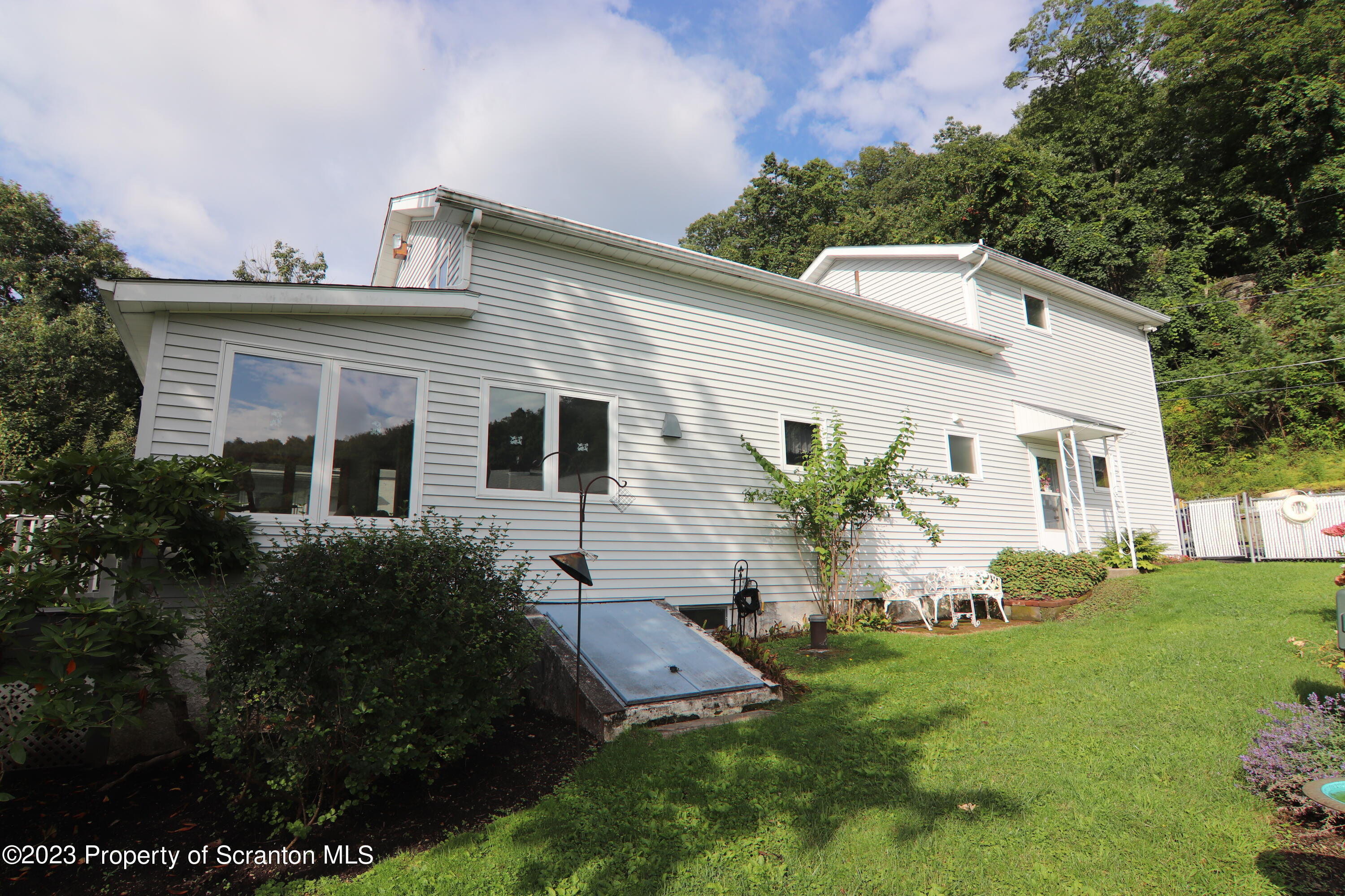 183 Oliver Road Sweet Valley, PA 18656 - Photo 5 of 54 a view of a house with a backyard