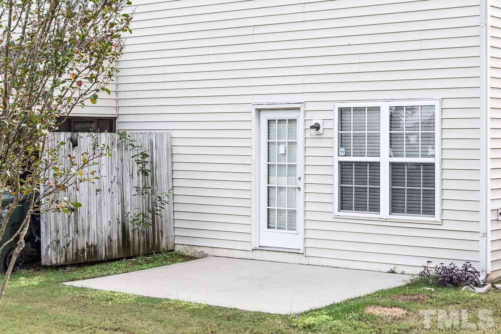 2044 Persimmon Ridge Drive Raleigh, NC 27604 - Photo 22 of 30 a front view of a house with a yard