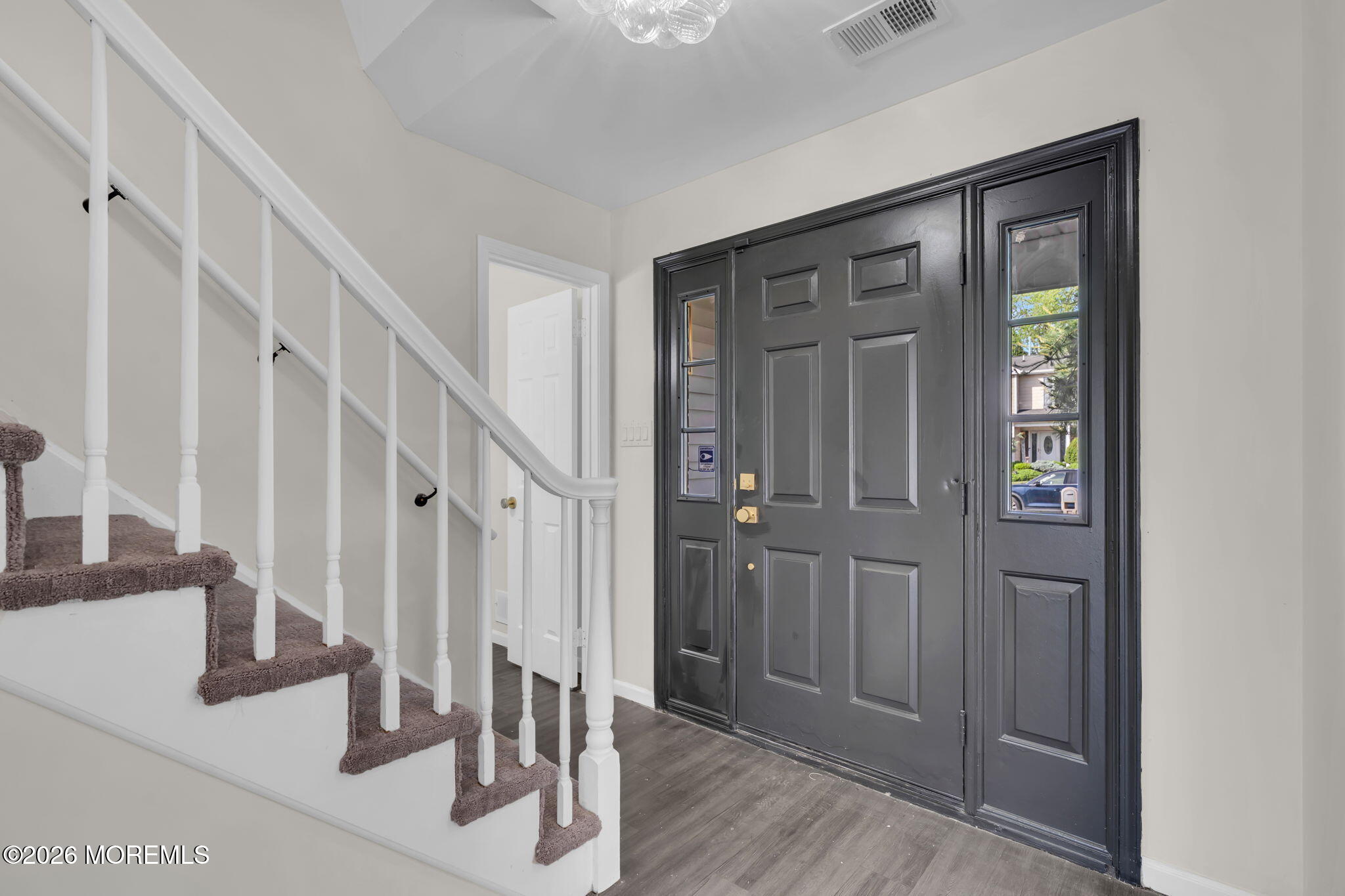 45 Peachstone Road Howell, NJ 07731 - Photo 8 of 54 a view of front door with hallway and wooden floor