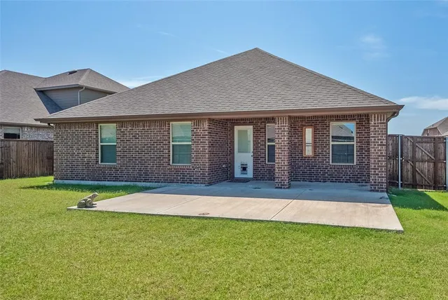 a house that has a big yard in front of it