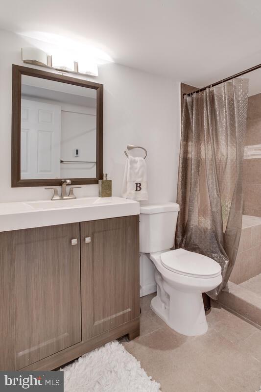 2144 Cedar Road Port Republic, MD 20676 - Photo 46 of 56 a bathroom with a toilet sink and mirror