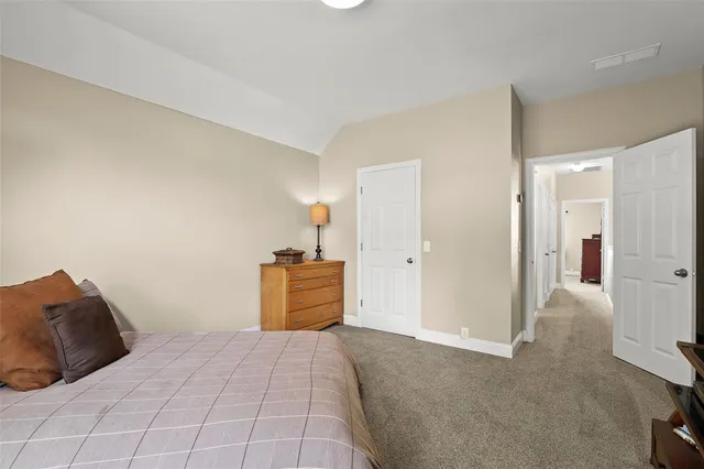 a bedroom with a bed and a cabinets