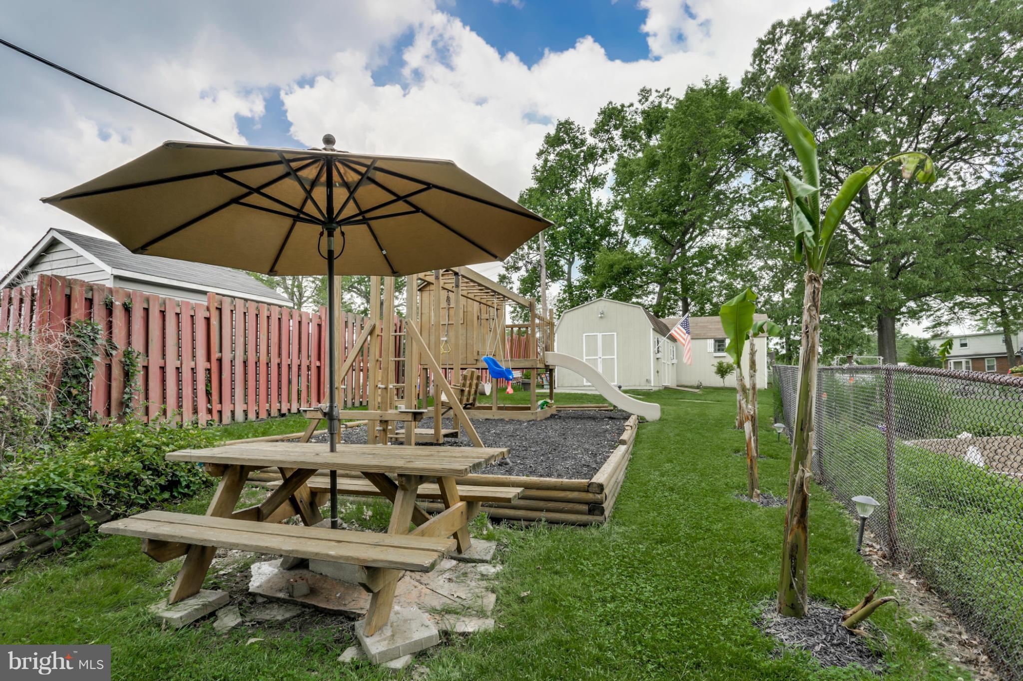 449 West Maple Road Linthicum Heights, MD 21090 - Photo 22 of 30 a view of a chair and table on the garden