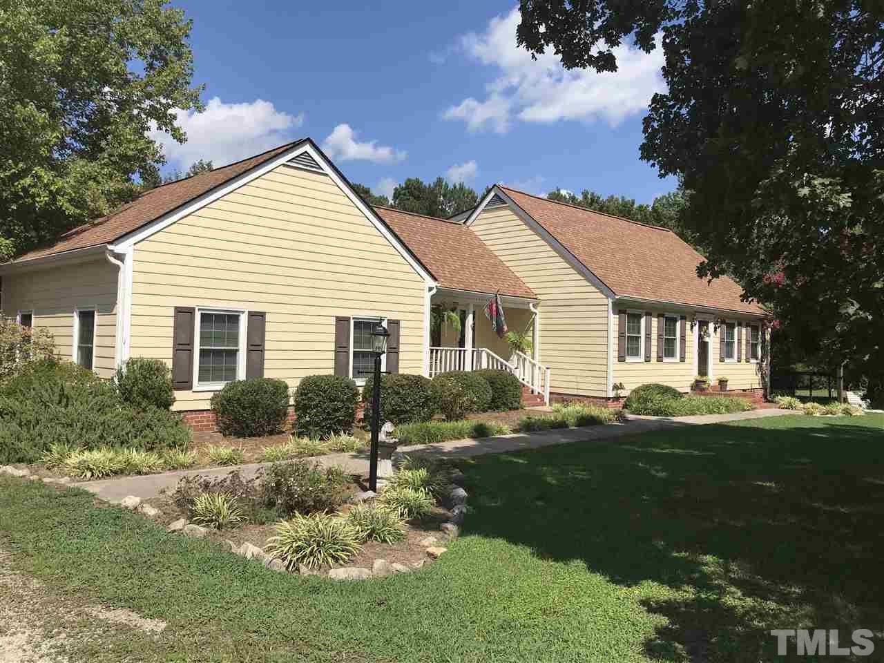518 Pilot-Riley Road Zebulon, NC 27597 - Photo 1 of 25 a front view of house with yard and green space