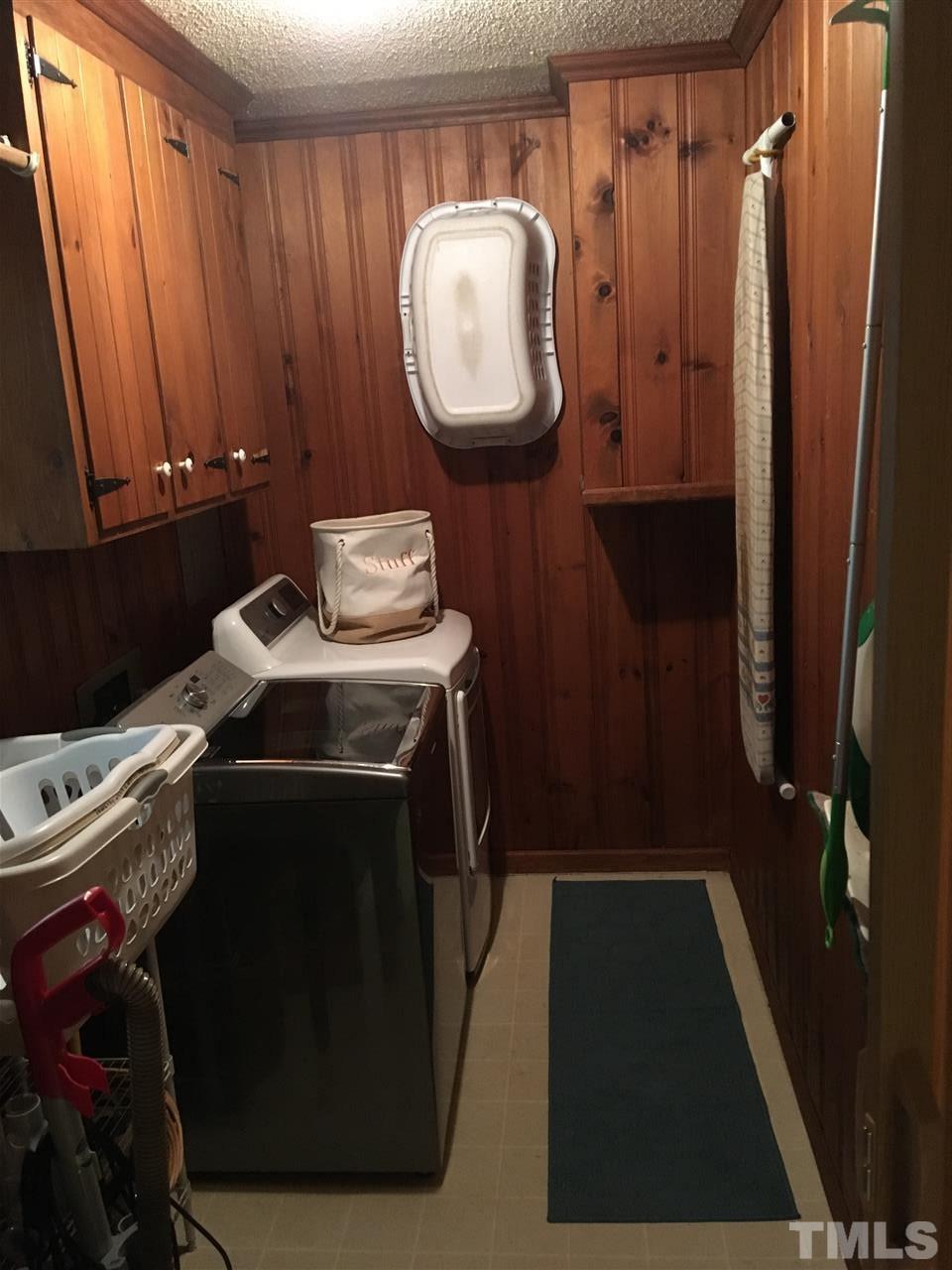 518 Pilot-Riley Road Zebulon, NC 27597 - Photo 13 of 25 a bathroom with a sink and a mirror
