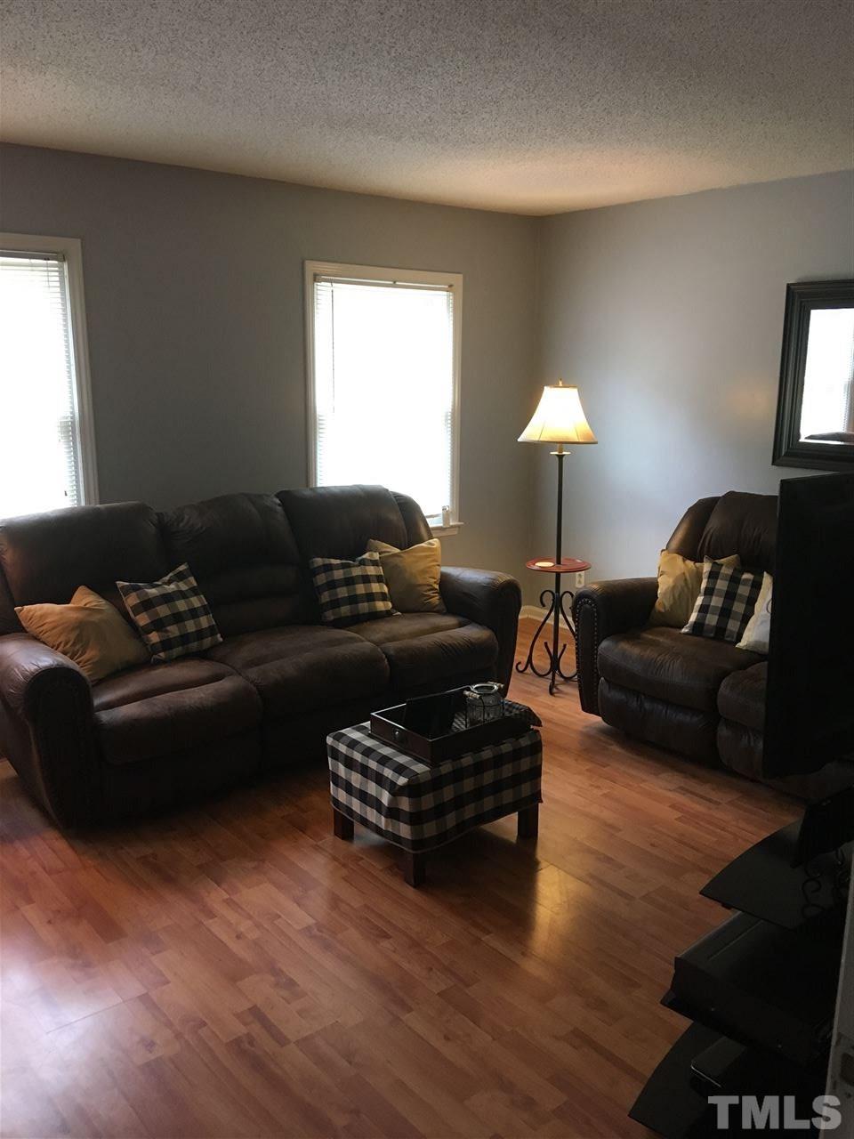 518 Pilot-Riley Road Zebulon, NC 27597 - Photo 17 of 25 a living room with furniture and a lamp