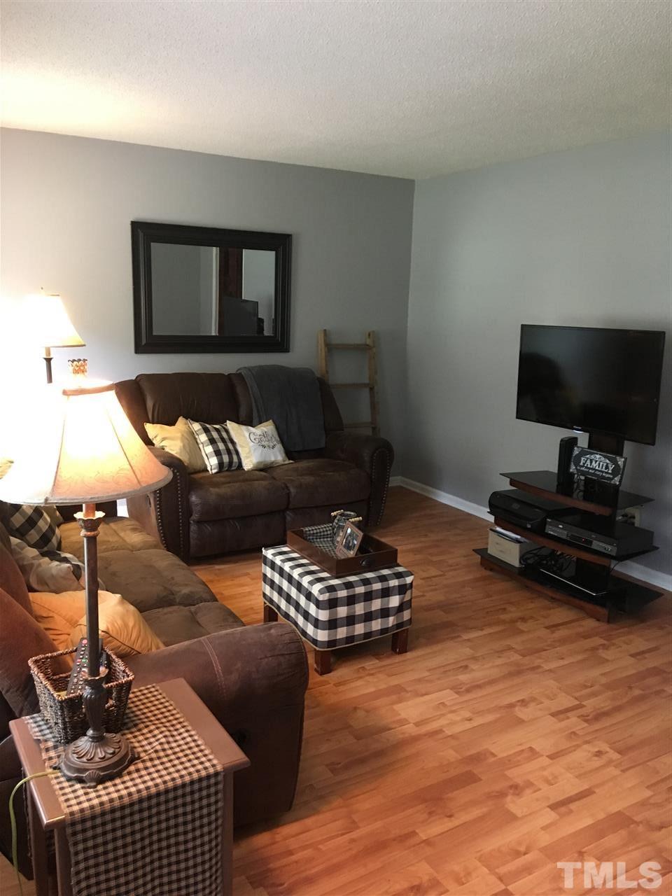518 Pilot-Riley Road Zebulon, NC 27597 - Photo 18 of 25 a living room with furniture and a flat screen tv