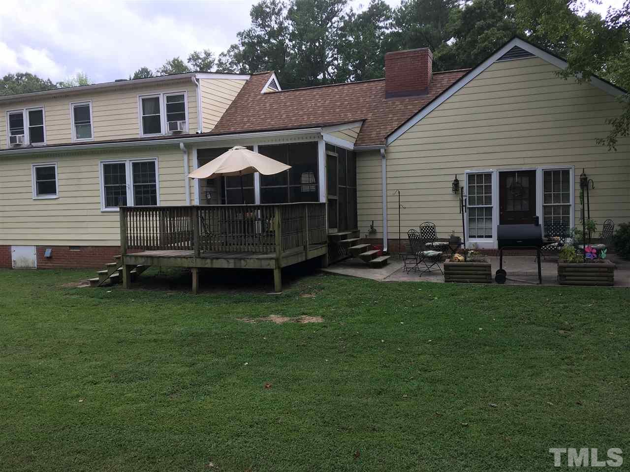 518 Pilot-Riley Road Zebulon, NC 27597 - Photo 3 of 25 a front view of a house with a garden
