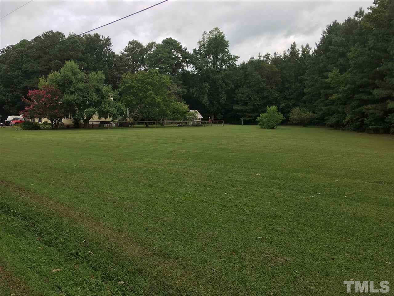 518 Pilot-Riley Road Zebulon, NC 27597 - Photo 5 of 25 a view of outdoor space with deck and yard