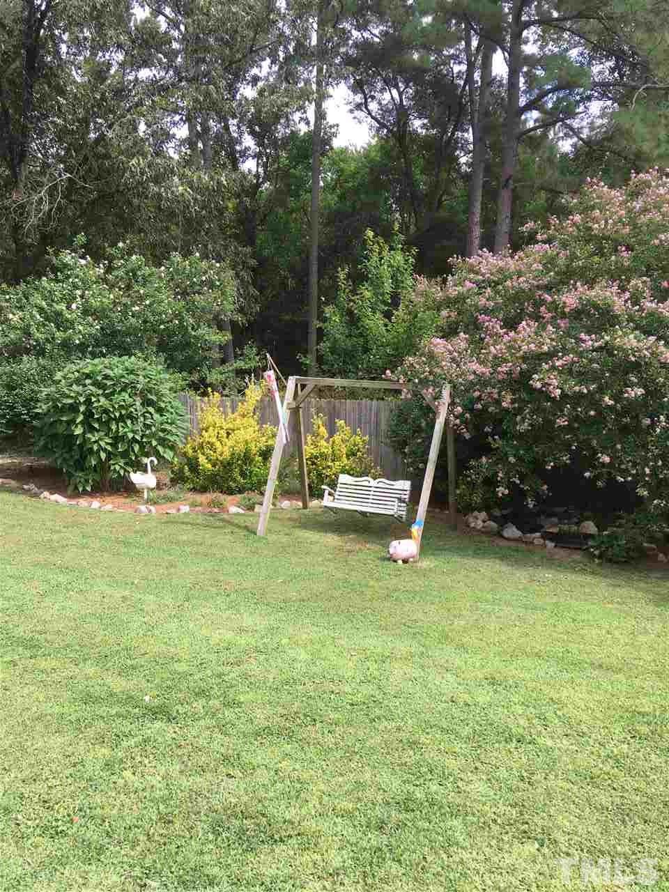 518 Pilot-Riley Road Zebulon, NC 27597 - Photo 9 of 25 a view of a garden with a slide