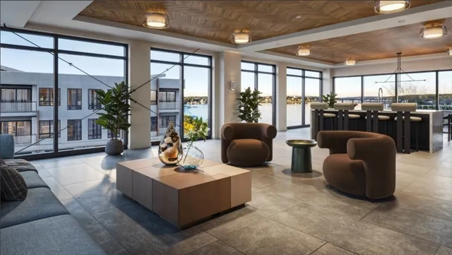 a living room with furniture a window and gym equipment