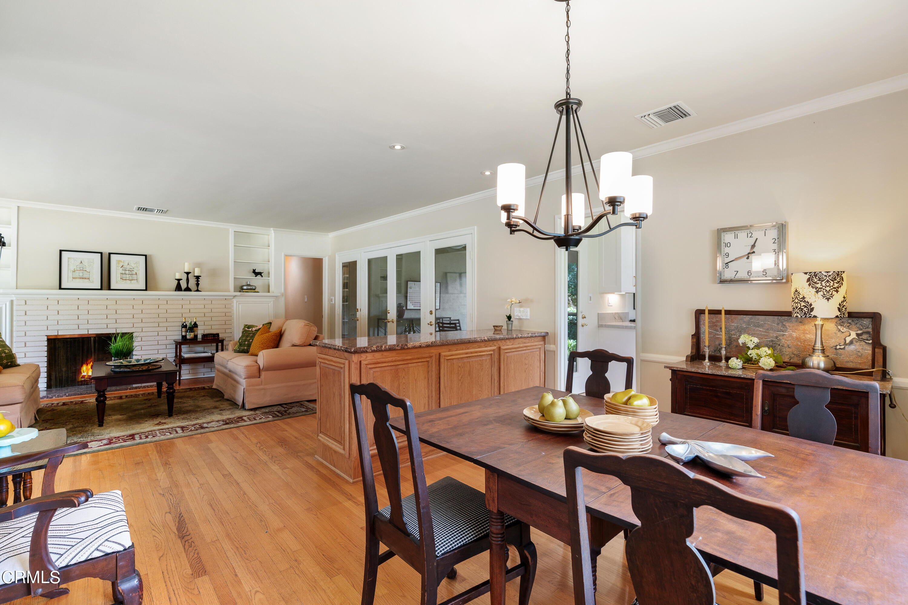 2155 Canyon Close Road Pasadena, CA 91107 - Photo 16 of 41 a view of a dining room with furniture a chandelier and wooden floor