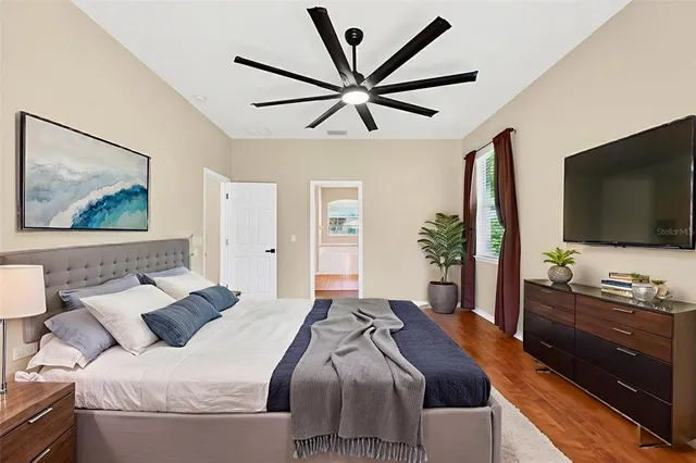 a spacious bathroom with a tub sink shower and mirror