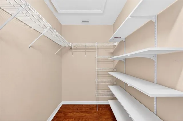 a kitchen with stainless steel appliances granite countertop a sink a refrigerator and a counter space