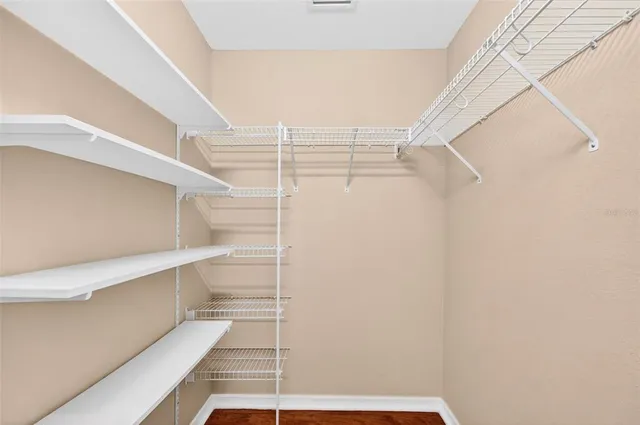 a kitchen with stainless steel appliances granite countertop a refrigerator stove top oven and sink